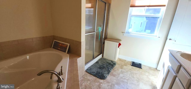 bathroom featuring shower with separate bathtub and vanity