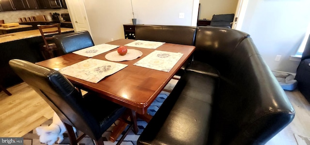 dining room with light hardwood / wood-style floors