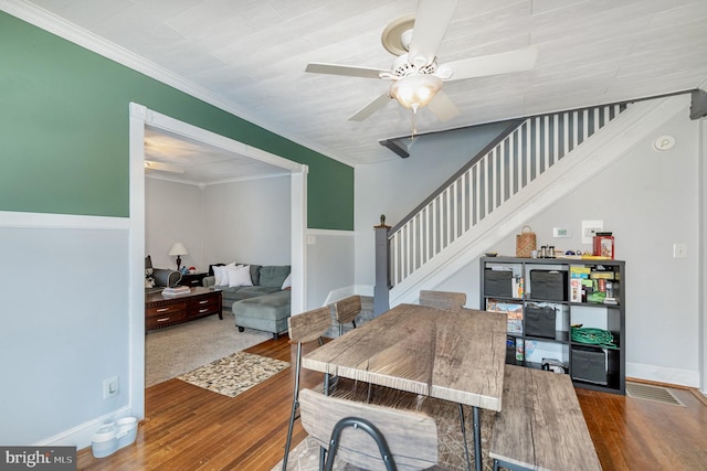 dining room featuring ceiling fan, ornamental molding, and hardwood / wood-style floors