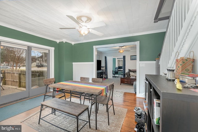 dining area with crown molding, ceiling fan, and light hardwood / wood-style flooring