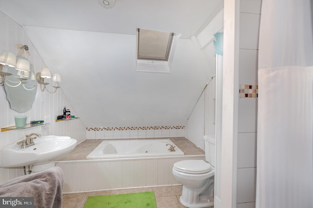 bathroom featuring tile patterned flooring, sink, a bathing tub, and toilet