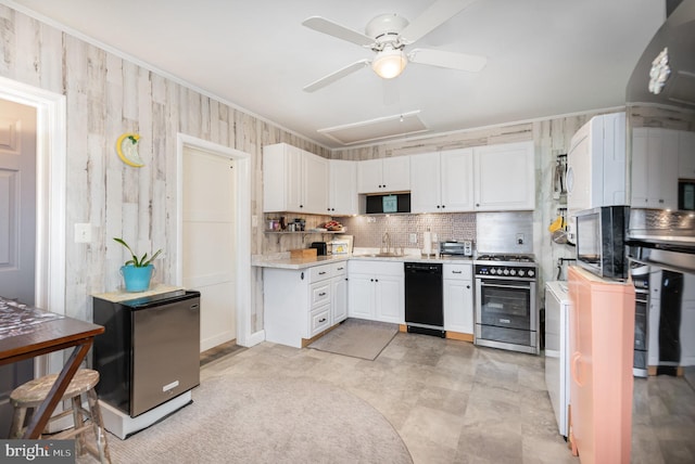 kitchen featuring crown molding, appliances with stainless steel finishes, ceiling fan, decorative backsplash, and white cabinets