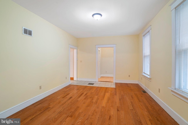 unfurnished room featuring light hardwood / wood-style floors