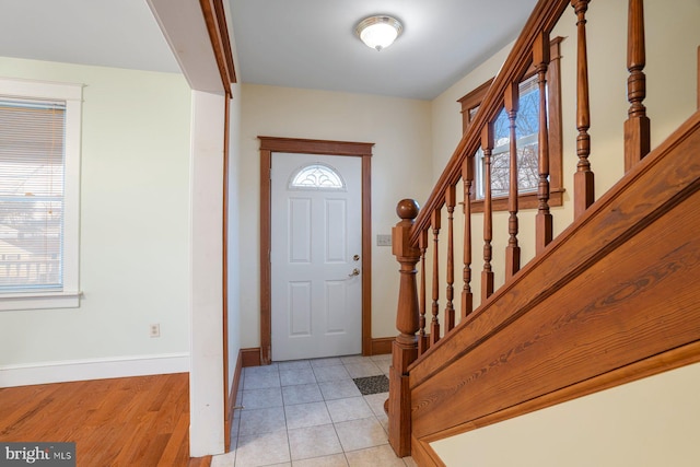 entryway featuring light tile patterned floors