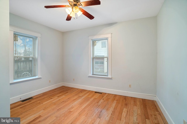 unfurnished room with light hardwood / wood-style flooring and ceiling fan