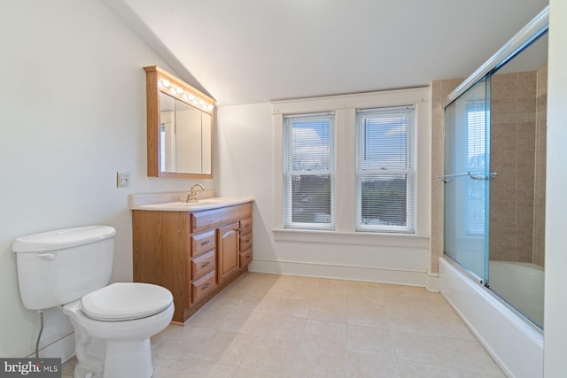 full bathroom with combined bath / shower with glass door, vanity, tile patterned flooring, toilet, and lofted ceiling