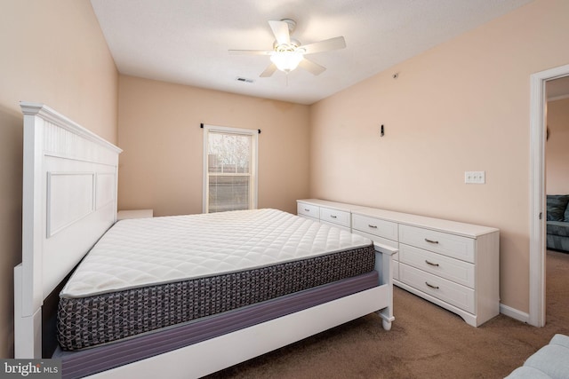 bedroom featuring ceiling fan and carpet