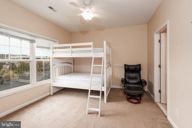 bedroom featuring ceiling fan and carpet floors