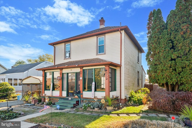 front facade featuring a sunroom