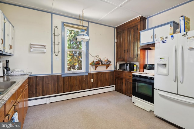 kitchen featuring exhaust hood, a baseboard radiator, pendant lighting, light colored carpet, and white appliances