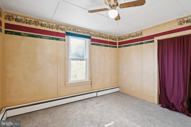 empty room with ceiling fan, carpet flooring, and a baseboard radiator