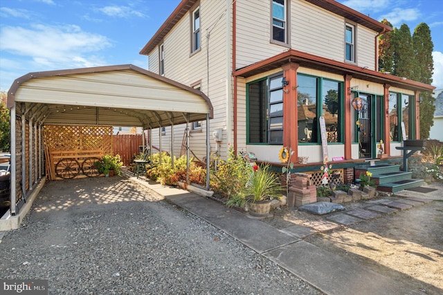 exterior space with a carport