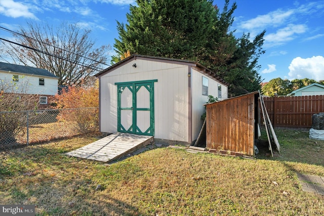 view of outbuilding with a lawn