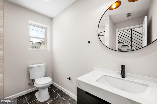 2442 Nicholas St, Philadelphia, PA 19121 - bathroom with vanity, toilet, baseboards, and visible vents