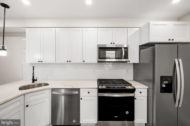 2442 Nicholas St, Philadelphia, PA 19121 - kitchen with a sink, open shelves, decorative backsplash, stainless steel appliances, and white cabinets