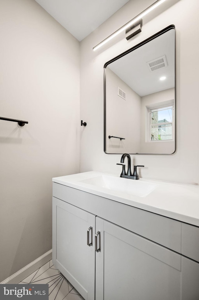 2442 Nicholas St, Philadelphia, PA 19121 - bathroom featuring marble finish floor, visible vents, baseboards, and vanity