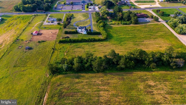 birds eye view of property featuring a rural view