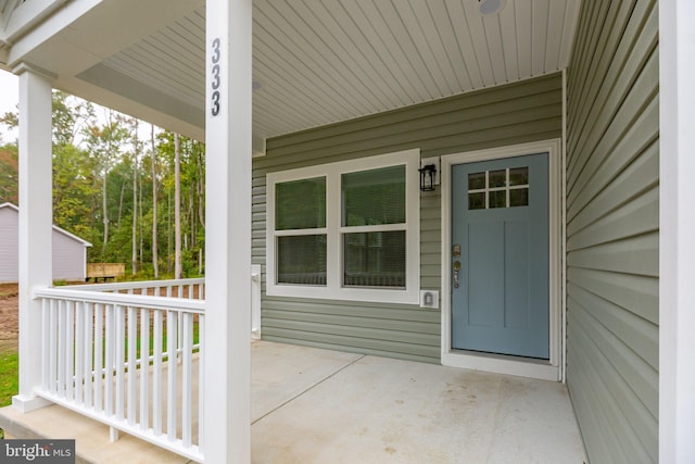 property entrance featuring a porch