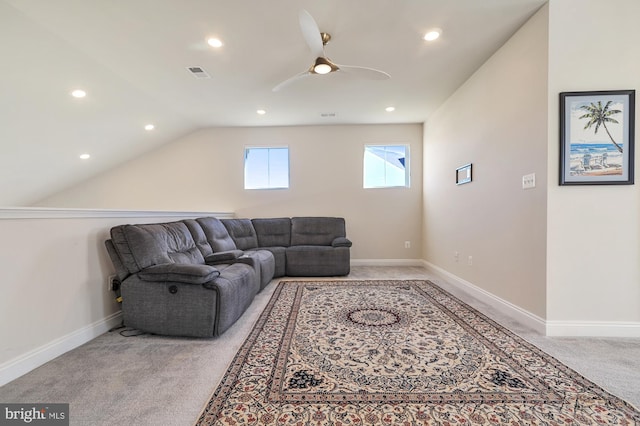 living room featuring ceiling fan, light colored carpet, and lofted ceiling