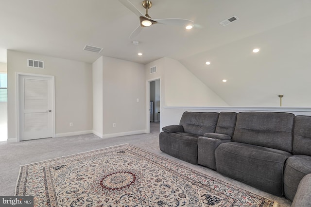 living room featuring light colored carpet, ceiling fan, and vaulted ceiling