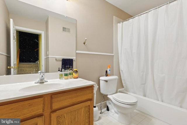 full bathroom with vanity, tile patterned floors, toilet, and shower / tub combo