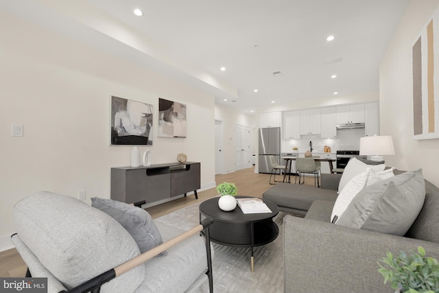 living room with light hardwood / wood-style floors