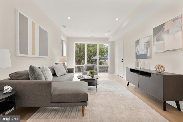 living room with light hardwood / wood-style floors