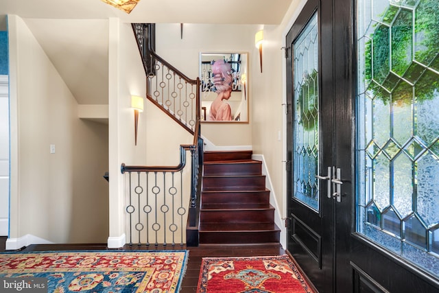 entrance foyer featuring french doors and dark wood-type flooring