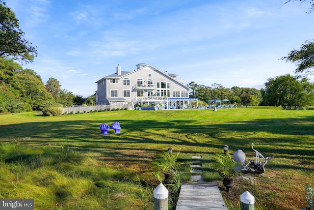 rear view of house with a lawn