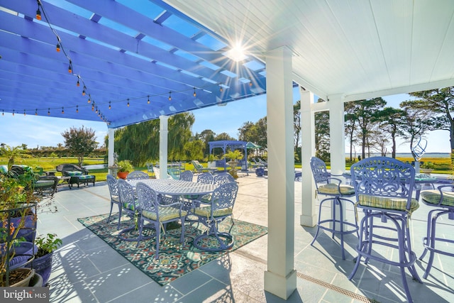 11209 Woodside Dr, Berlin, MD 21811 - view of patio / terrace featuring a pergola, outdoor dining space, and exterior bar