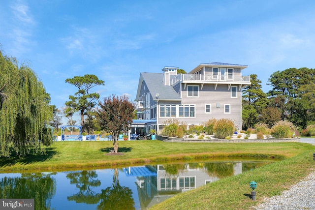 11209 Woodside Dr, Berlin, MD 21811 - back of property with a water view, a yard, and a balcony