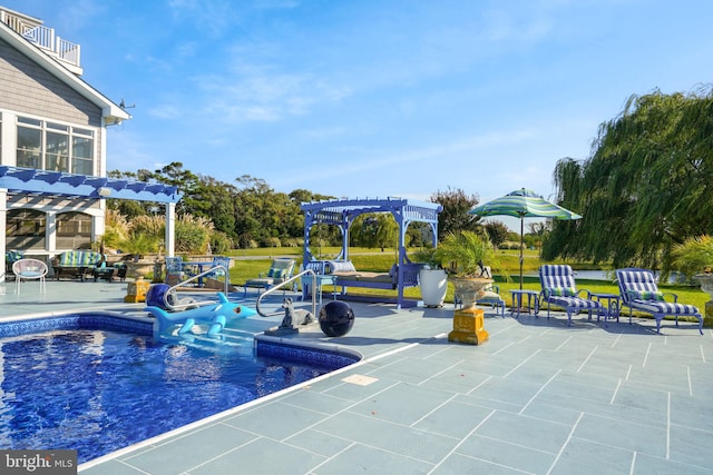 view of pool featuring a pergola, a yard, and a patio