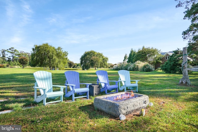 view of yard with an outdoor fire pit