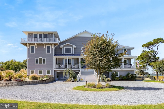 view of front of property featuring a porch and a garage