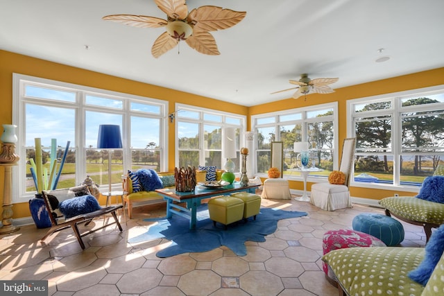 sunroom / solarium with ceiling fan