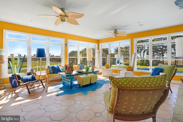 sunroom with ceiling fan and a healthy amount of sunlight