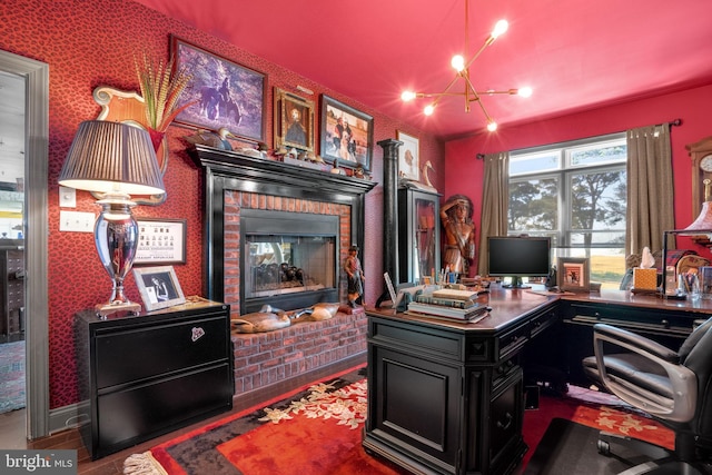 11209 Woodside Dr, Berlin, MD 21811 - home office featuring an inviting chandelier and a fireplace