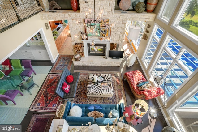 living room with a towering ceiling and a notable chandelier