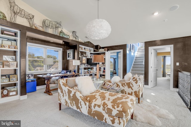 dining area featuring light carpet and lofted ceiling