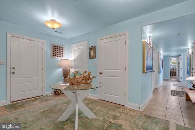 11209 Woodside Dr, Berlin, MD 21811 - entrance foyer featuring light tile patterned floors, visible vents, and baseboards