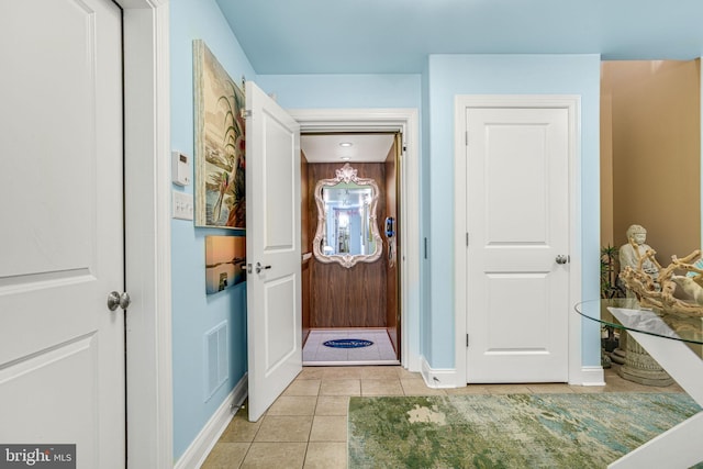 11209 Woodside Dr, Berlin, MD 21811 - interior space featuring an inviting chandelier, baseboards, visible vents, and tile patterned floors