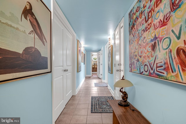 11209 Woodside Dr, Berlin, MD 21811 - hall with light tile patterned floors and baseboards