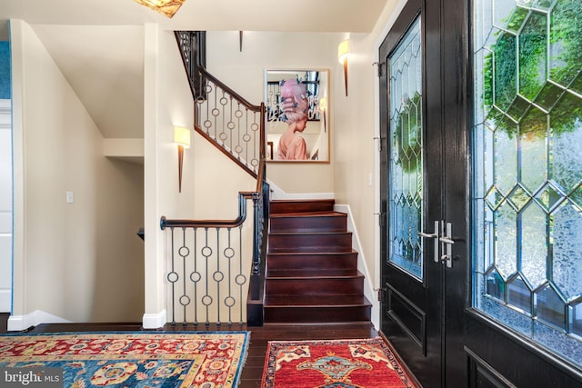 11209 Woodside Dr, Berlin, MD 21811 - entryway featuring french doors, wood finished floors, stairway, and baseboards
