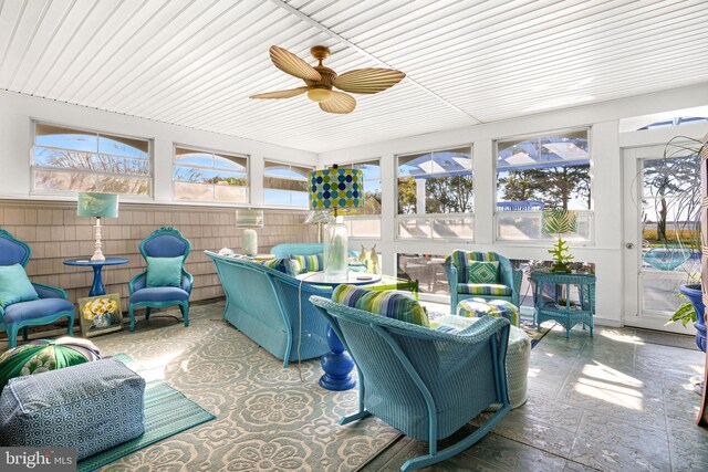 sunroom / solarium with ceiling fan