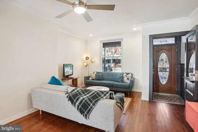 living room with wood-type flooring, ceiling fan, and crown molding