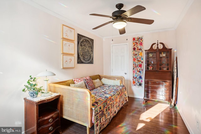 bedroom featuring ceiling fan, crown molding, and dark wood-type flooring