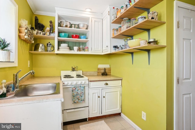 kitchen with white cabinetry, sink, white range, crown molding, and light tile patterned floors