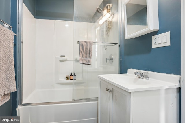 bathroom featuring vanity and bath / shower combo with glass door