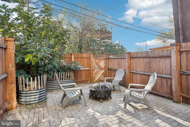 view of patio featuring an outdoor fire pit