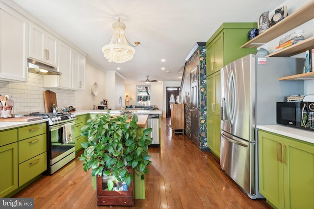 kitchen with dark hardwood / wood-style flooring, backsplash, stainless steel appliances, green cabinetry, and white cabinets